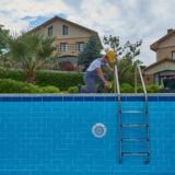 Repairman,Is,Repairing,Pool,With,Equipment.,Pool,Maintenance,Style.